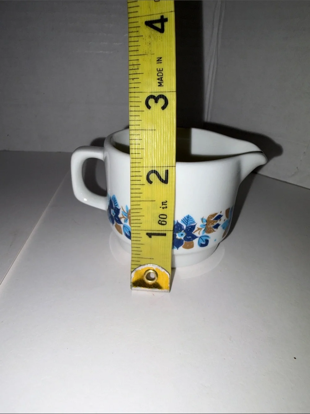 Vitro White Ceramic Creamer with Blue and Gold Floral Pattern